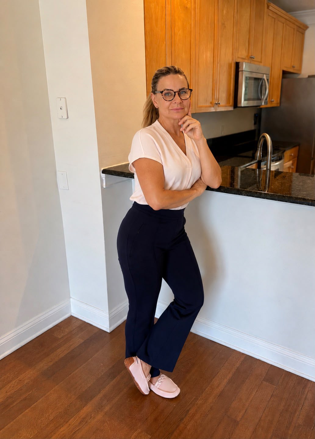 Lucie Kucerova, Real Estate Advisor, standing in a Jacksonville Beaches kitchen